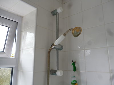 6  Found Shower Bracket, Ends capped with Bottle tops.JPG